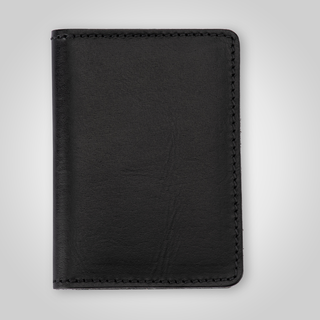 Black leather wallet on a light gray background