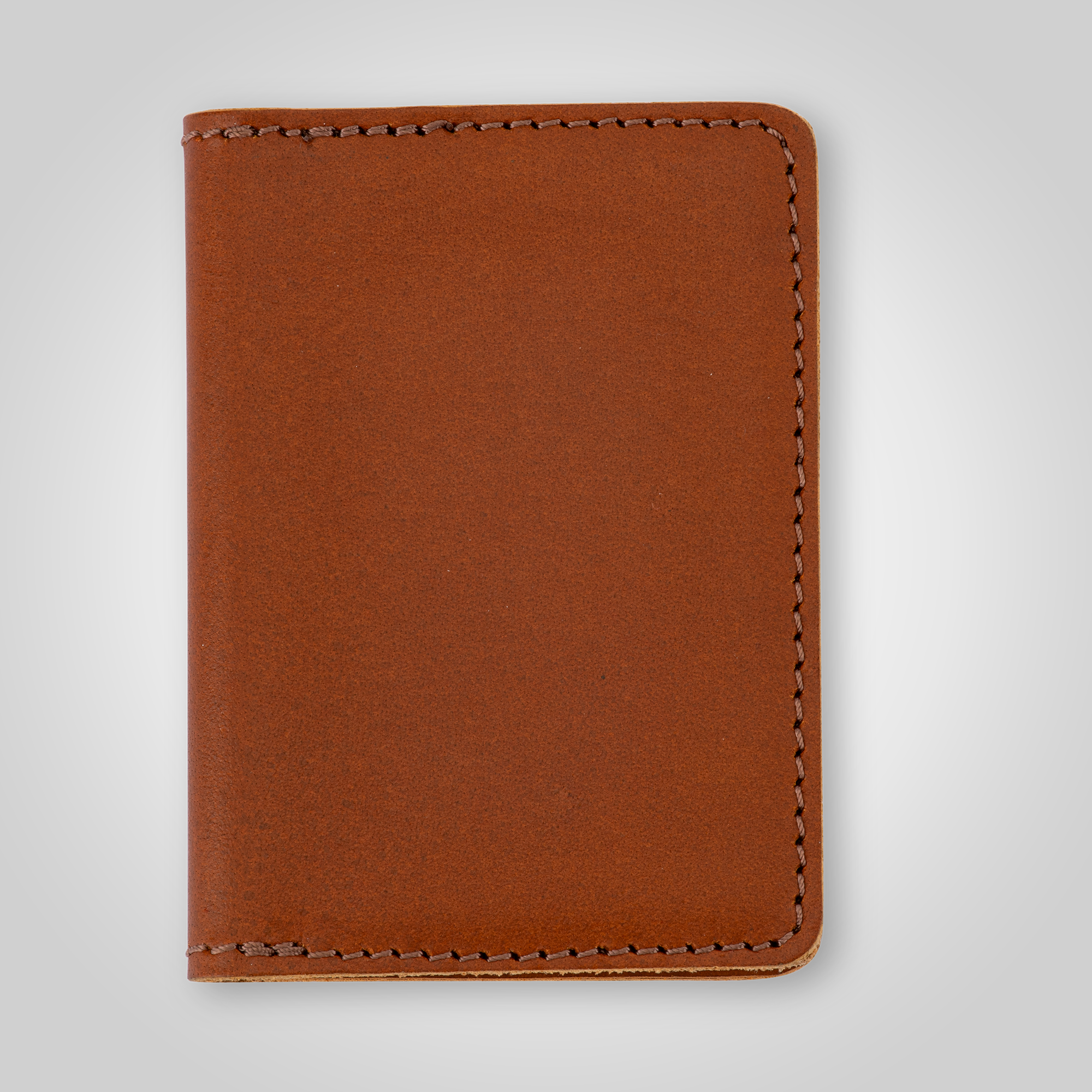 Brown leather wallet on a light gray background