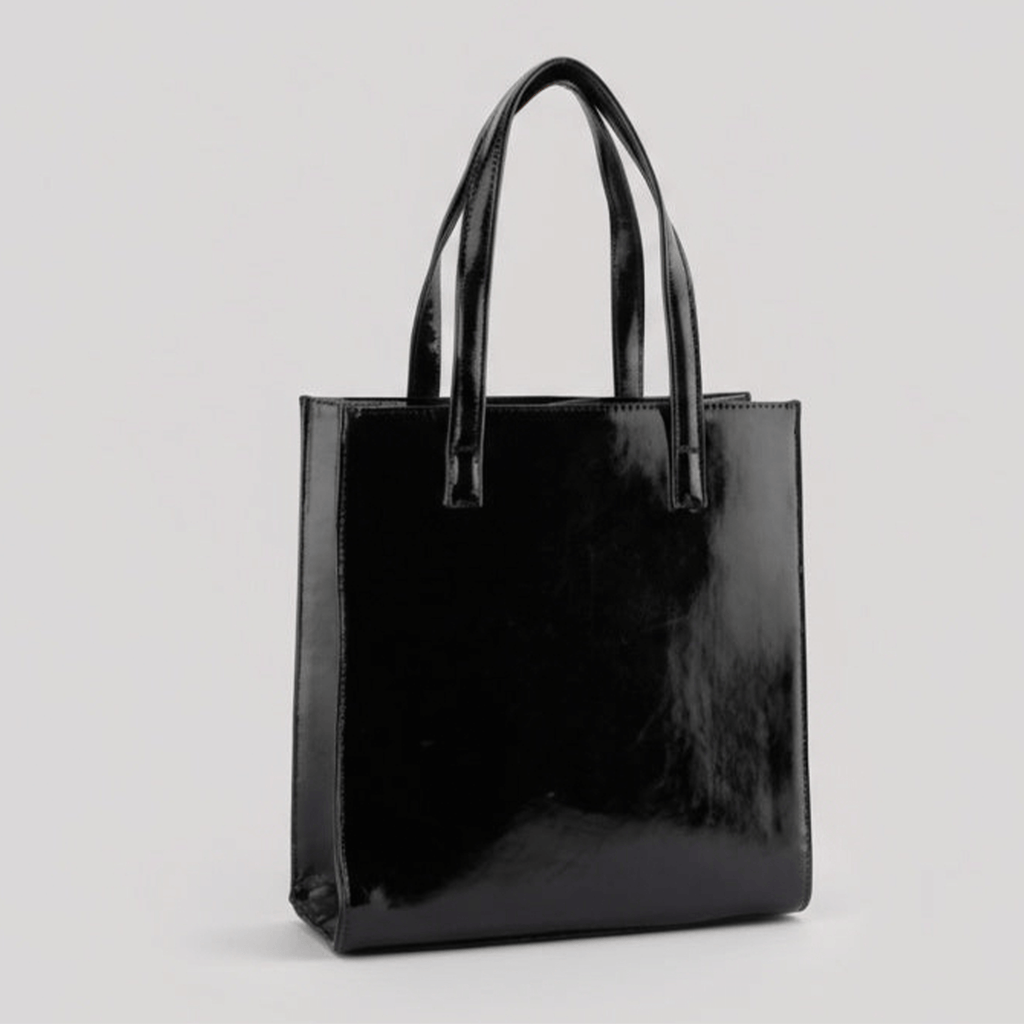 Black shiny tote bag on a light gray background